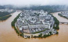 Hundreds of thousands evacuated as floods ravage southern China