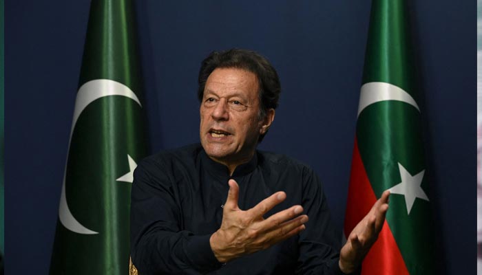 PTI Chairman Imran Khan gestures as he speaks during an interview with AFP at his residence in Lahore on May 18, 2023. — AFP
