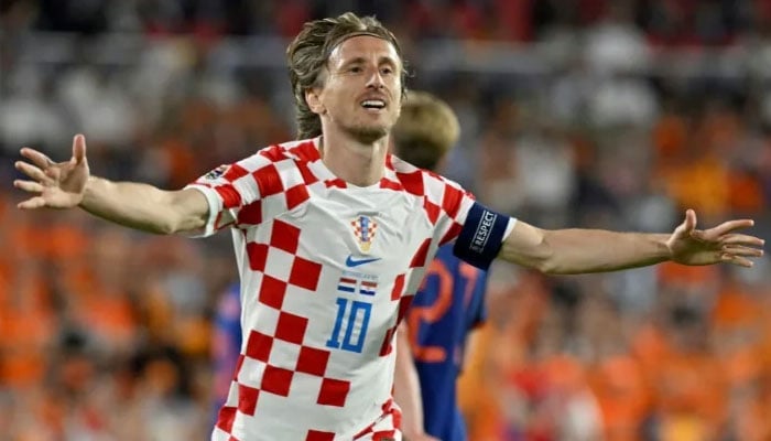 Croatia midfielder Luka Modric celebrates after scoring his teams fourth goal from the penalty spot against the Netherlands. AFP