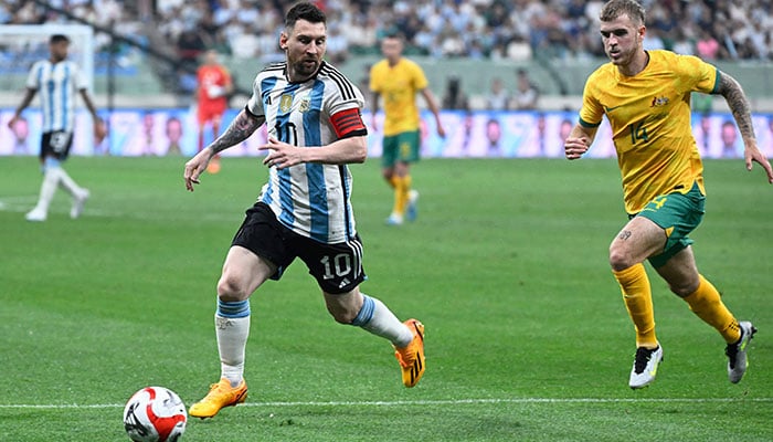 Argentina´s Lionel Messi (2L) fights for the ball during a friendly football match against Australia at the Workers´ Stadium in Beijing on June 15, 2023.—AFP