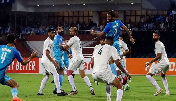 India´s Subhasish Bose (2L) jumps to head the ball during the Group A South Asian Football Federation Championship match between India and Pakistan at the Shree Kanteerava Stadium in Bengaluru on June 21, 2023. — AFP