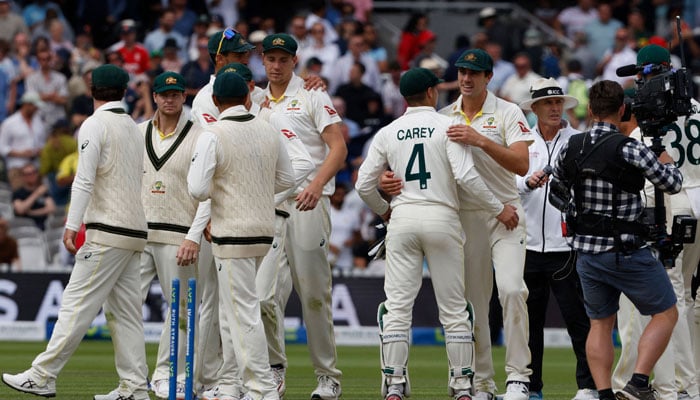 Australia’s players celebrate on the field after they win on day five of the second Ashes cricket Test match between England and Australia at Lord´s cricket ground in London on July 2, 2023. — AFP