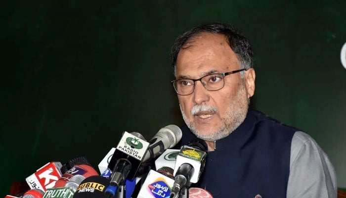 Minister for Planning and Development Ahsan Iqbal addressing the media in Lahore. — PID/ file