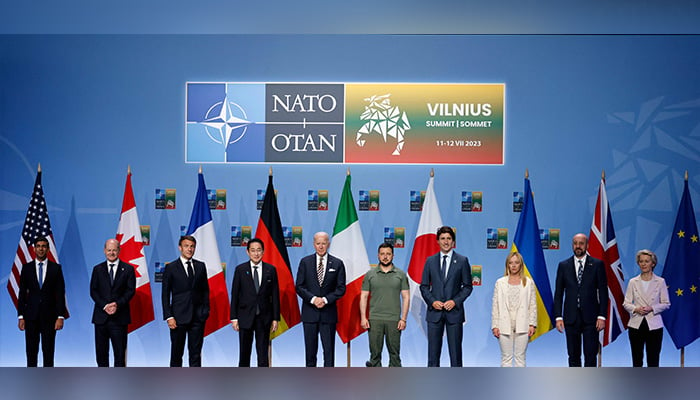 (L to R) Britains PM Rishi Sunak, Germanys Chancellor Olaf Scholz, Frances President Emmanuel Macron, Japans PM Fumio Kishida, US President Joe Biden, Ukraines President Volodymyr Zelensky, Canadas PM Justin Trudeau, Italys PM Giorgia Meloni, European Council President Charles Michel, and President of the European Commission Ursula von der Leyen pose during an event to announce a Joint Declaration of Support for Ukraine during the NATO summit, in Vilnius on July 12, 2023. — AFP