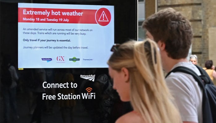 A heat warning sign at a train station in London. AFP/File