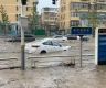 Heaviest rain in a decade kills 11 in Beijing as raging torrents wash away roads and cars