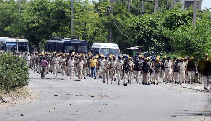 Extra police personnel are deployed in Nuh, India, on August 1, 2023. 