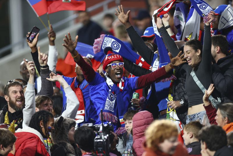 Haiti fans cheer their team at the stadium in Perth, Australia.