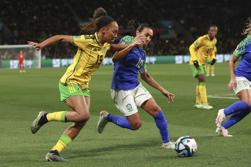Brazil's Marta, right, competes against Jamaica's Tiernny Wiltshire during a Women's World Cup match on Wednesday, August 2. <a href="https://www.cnn.com/2023/08/01/football/brazil-jamaica-france-panama-womens-world-cup-spt-intl/index.html" target="_blank">The two teams drew 0-0</a>, but it was Jamaica that advanced to the knockout stage of the tournament. This was the last World Cup for Marta, the tournament's record scorer and veteran of six tournaments.