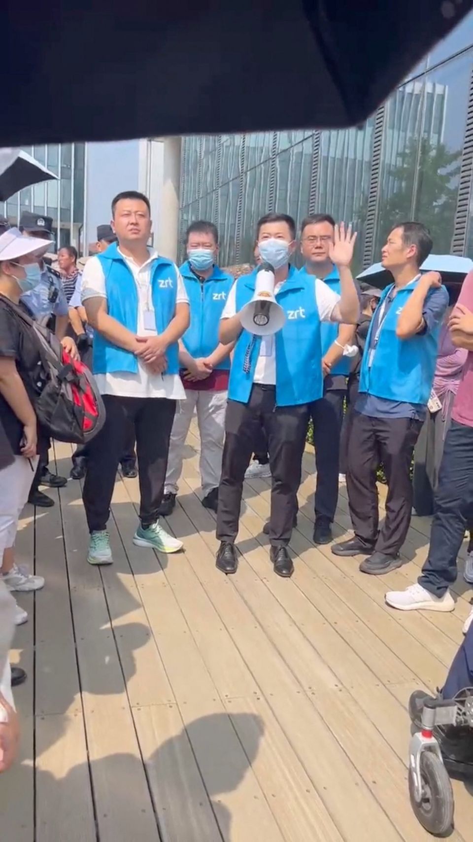 People protest outside Zhongrong International Trust’s office in Beijing, in this screengrab obtained from a social media video released on Wednesday. Photo: Reuters