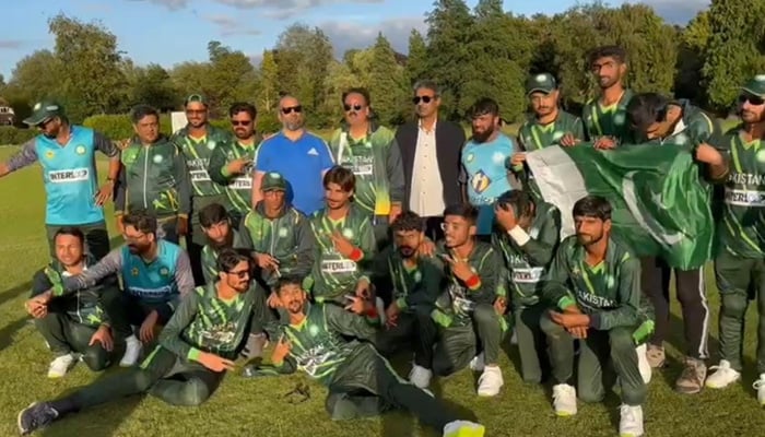 Pakistans blind cricket team pose for a photograph after their win against India. — Photo by author