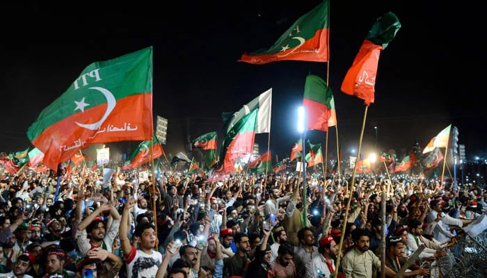 PTI workers while at an election rally. — AFP/File