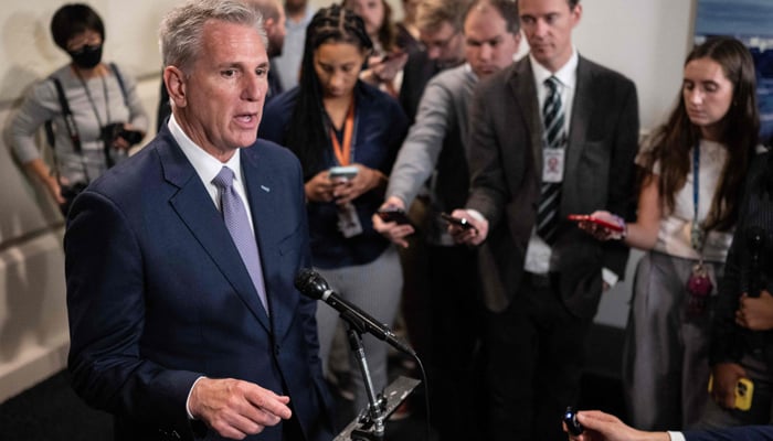 US Speaker of the House, Kevin McCarthy Republican of California, speaks to the press after meeting with his caucus on Capitol Hill in Washington, DC, on September 30, 2023. — AFP