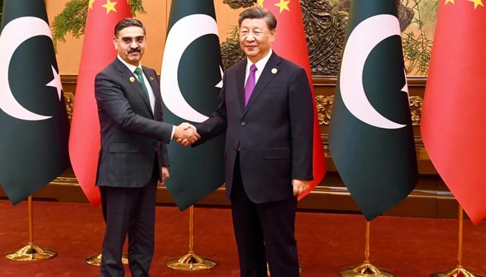 Caretaker Prime Minister Anwaar-ul-Haq Kakar while shaking hands with Chinese President Xi Jinping at the Great Hall of People on the sidelines of the Third Belt and Road Forum being held in Beijing on October 19, 2023. — X/@GovtofPakistan