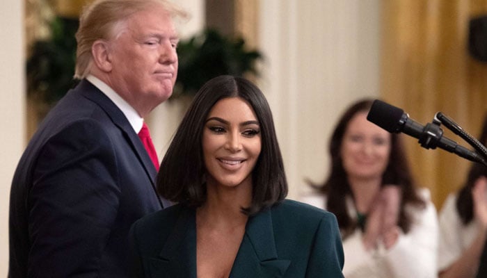 Kim Kardashian meets Donald Trump and several women whose prison sentences he commuted at the White House in 2016. — AFP