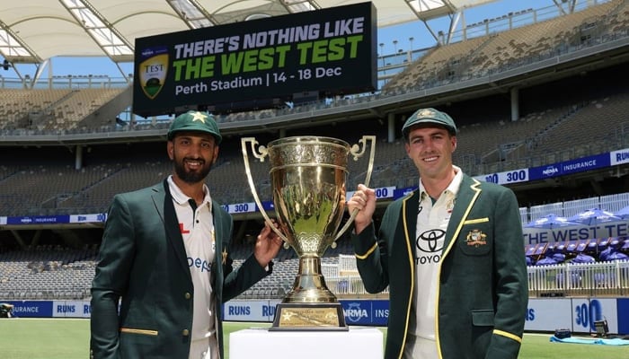 Pakistan captain Shan Masood with Australias captain Pat Cummins. — PCB