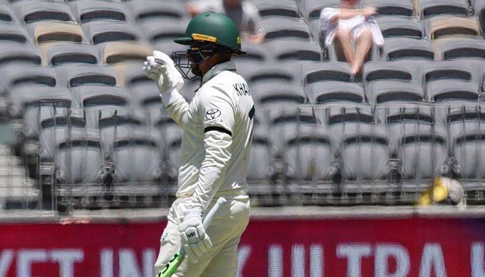Australia batter Usman Khawaja is seen sporting a black armband during the first day of the first Test cricket match between Australia and Pakistan at Optus Stadium in Perth on December 14, 2023. — AFP