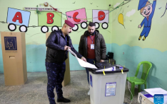 Iraqi security personnel cast ballots ahead of provincial elections