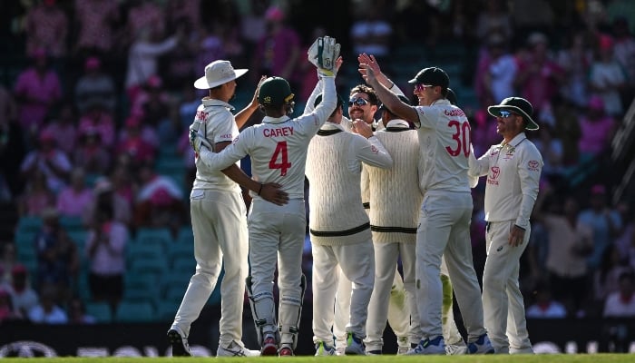 Australias Travis Head (C) celebrates the wicket of Pakistans Babar Azam with teammates during day three of the third Test between Australia and Pakistan at the Sydney Cricket Ground on January 5, 2024. —AFP