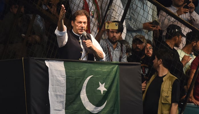 Former Prime Minister and Pakistan Tehreek-e-Insaf party (PTI) founding chief Imran Khan, delivers a speech to his supporters during a rally to celebrate the 75th anniversary of Pakistans independence day in Lahore on August 13, 2022. — AFP