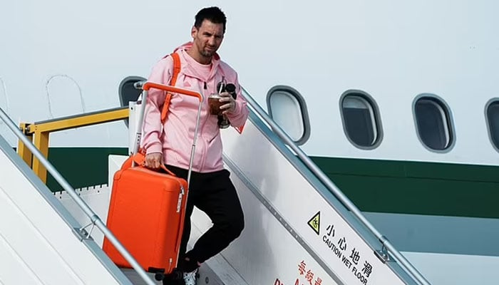Lionel Messi landing in Hong Kong. — AFP/File
