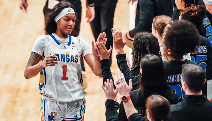 Kansas Jayhawks star centre, Taiyanna Jackson high-fives her teammates. — Kansan/File