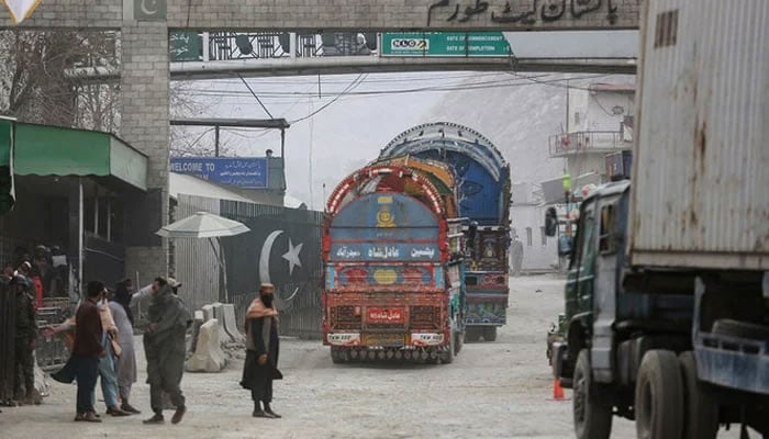 Goods carrier trucks cross into Pakistan at the zero point Torkham border crossing between Afghanistan and Pakistan. — AFP/File