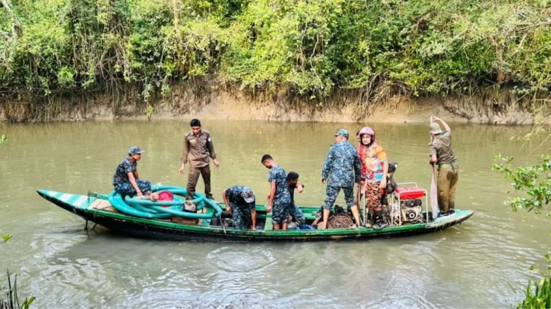 Members of the Fire Service and Civil Defence and Bangladesh Coast Guard on a boat in the Sundarbans during their operation to extinguish the fire on Sunday, May 5, 2024. Photo: Bangla Tribune