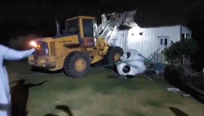 CDA machinery demolishing a portion of the PTIs Central Secretariat in Islamabad, on May 23, 2024. — Screengrab/X/@PTIOfficial