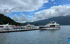 Tourists visit Riyue Tan scenic spot during holiday of Dragon Boat Festival