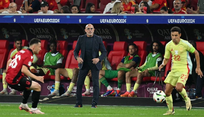 Spains head coach Luis de la Fuente watches from the sideline during the UEFA Euro 2024 Group B football match between Albania and Spain at the Duesseldorf Arena in Duesseldorf on June 24, 2024. — AFP