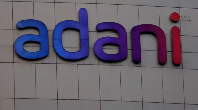 The logo of the Adani Group is seen on the facade of its Corporate House on the outskirts of Ahmedabad, India on January 27, 2023. Photo: Reuters