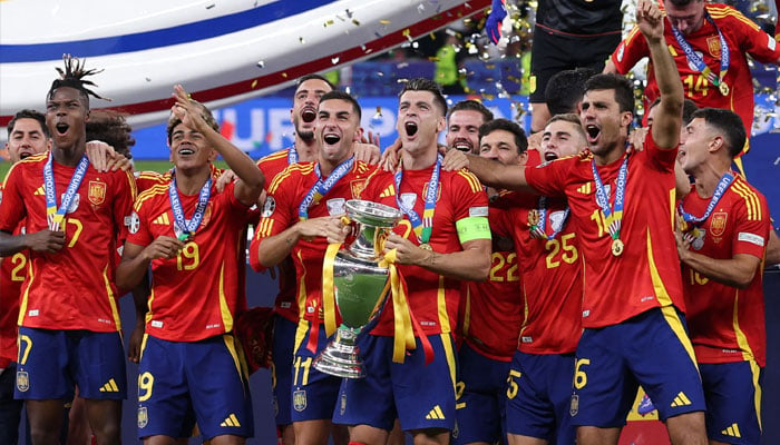 Spain´s forward Alvaro Morata holds the trophy and celebrates with teammates after winning the UEFA Euro 2024 final football match between Spain and England at the Olympiastadion in Berlin on July 14, 2024. — AFP