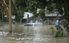 Storm blows away from northern Philippines leaving 65 dead but forecasters warn it may do a U-turn