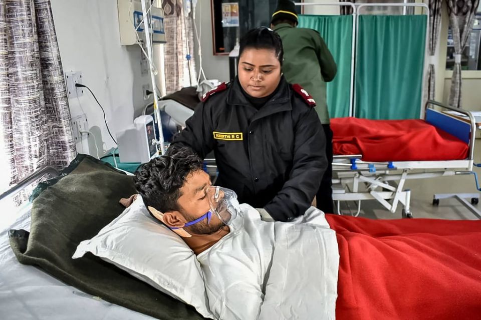 An injured BRO worker who was trapped under an avalanche receives treatment after being airlifted by rescuers at the Jyotirmath Army Hospital in Chamoli district of India’s Uttarakhand state. Photo: AFP