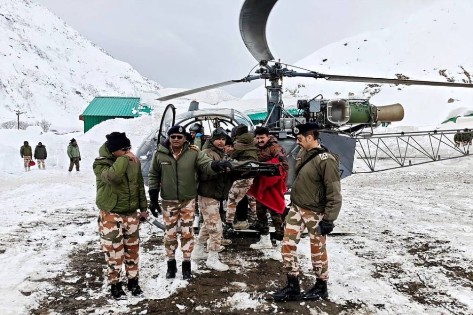 Security personnel carry a victim onto a helicopter during a rescue operation, a day after an avalanche hit a Border Roads Organisation (BRO) construction camp, near Mana village in the Chamoli district of India’s Uttarakhand state on Saturday. Photo: AFP