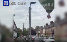 遛狗路人立大功 英国一偏航热气球有惊无险落回地面