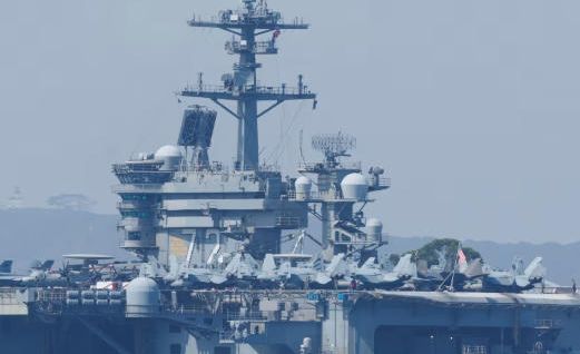 US carrier shoots down Iranian drone as tensions escalate and diplomatic talks hit a snag