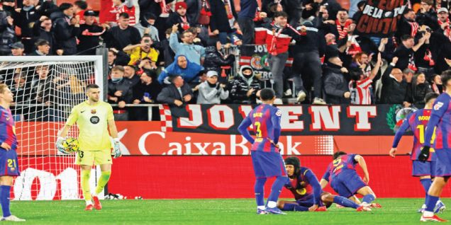 Barca suffer title defence blow in Girona derby defeat